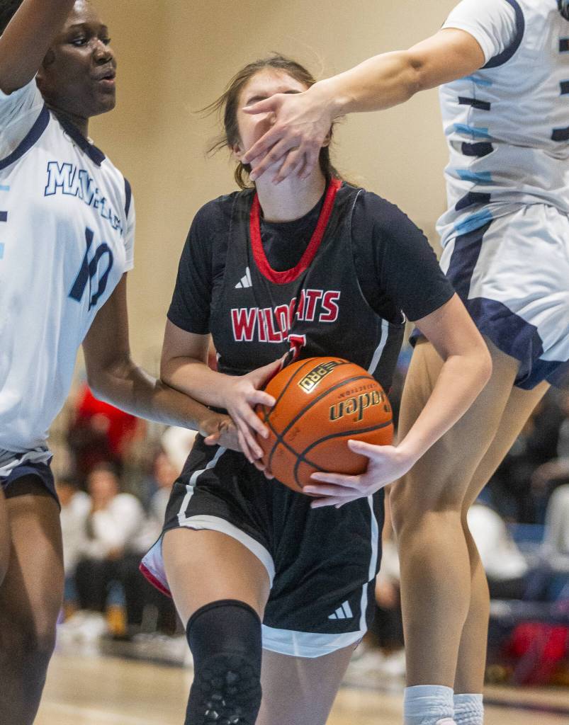 Archbishop Murphys Ava Marr is hit in the face and fouled during the game against Meadowdale on Friday, Jan. 3, 2025 in Lynnwood, Washington. (Olivia Vanni / The Herald)