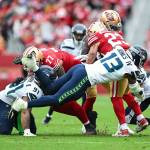 Seahawks linebacker Ernest Jones IV (13) tackles San Francisco running back Christian McCaffery (23) in the Seahawks' 20-17 victory over the 49ers at Levi's Stadium on Nov. 17, 2024. (Photo courtesy of the Seattle Seahawks)