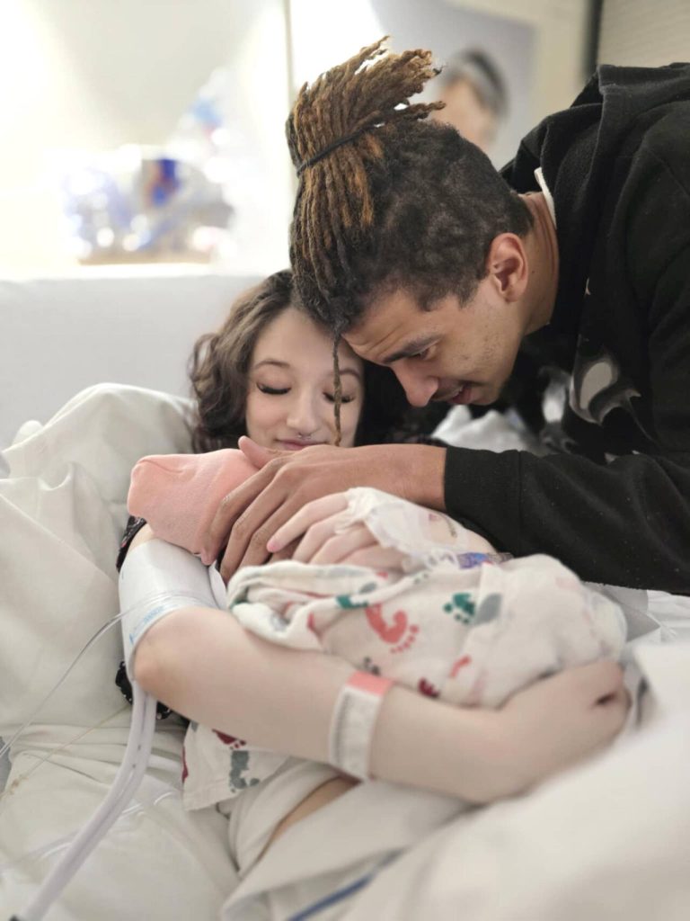 Amber-Lynne Rickett and Steffen Horne, of Lynnwood, welcome Jheneah Elowyn Horne, the first baby born at Swedish Edmonds in 2025. (Provided photo)