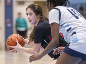 Archbishop Murphy’s Ava Marr looks for an open teammate to pass to during the game against Meadowdale on Friday, Jan. 3, 2025 in Lynnwood, Washington. (Olivia Vanni / The Herald)