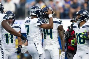 Seahawks quarterback Geno Smith (7) celebrates with receiver DK Metcalf (14) after a touchdown against the Los Angeles Rams at SoFi Stadium on Sunday, Jan. 5, 2025. (Photo courtesy of Rod Mar / Seattle Seahawks)