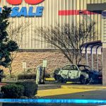 Mike Henneke / The Herald
Crime scene tape surrounds a burned car Tuesday at the Costco at Lakewood Crossing in Marysville.