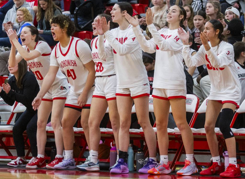 The Snohomish bench reacts to a three point shot during the game against Stanwood on Thursday, Jan. 9, 2025 in Snohomish, Washington. (Olivia Vanni / The Herald)
