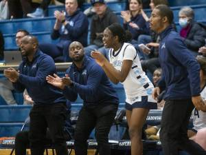 The Meadowdale bench and coaches react to a three point shot during the game on Friday, Jan. 3, 2025 in Lynnwood, Washington. (Olivia Vanni / The Herald)