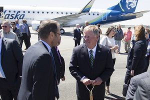 Everett Mayor Ray Stephenson, center, talks with Alaska Airlines Inc. CEO Brad Tilden after the groundbreaking ceremony for the new Paine Field passenger terminal on Monday, June 5, 2017 in Everett, Wa. (Andy Bronson / The Herald)