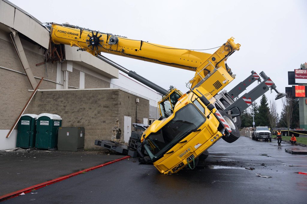 Will Geschke / The Herald
A crane toppled into a section of the Everett Mall on Thursday.