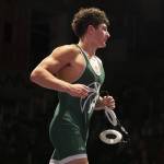 Edmonds-Woodways Ever Yamada runs off the mat after winning the 175-pound match on Thursday, Jan. 16, 2025 in Edmonds, Washington. (Olivia Vanni / The Herald)
