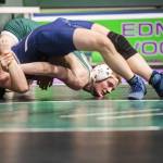 Edmonds-Woodways Dylan Rice tries to push Meadowdales Logan Palmer toward the mat during the 144-pound match on Thursday, Jan. 16, 2025 in Edmonds, Washington. (Olivia Vanni / The Herald)