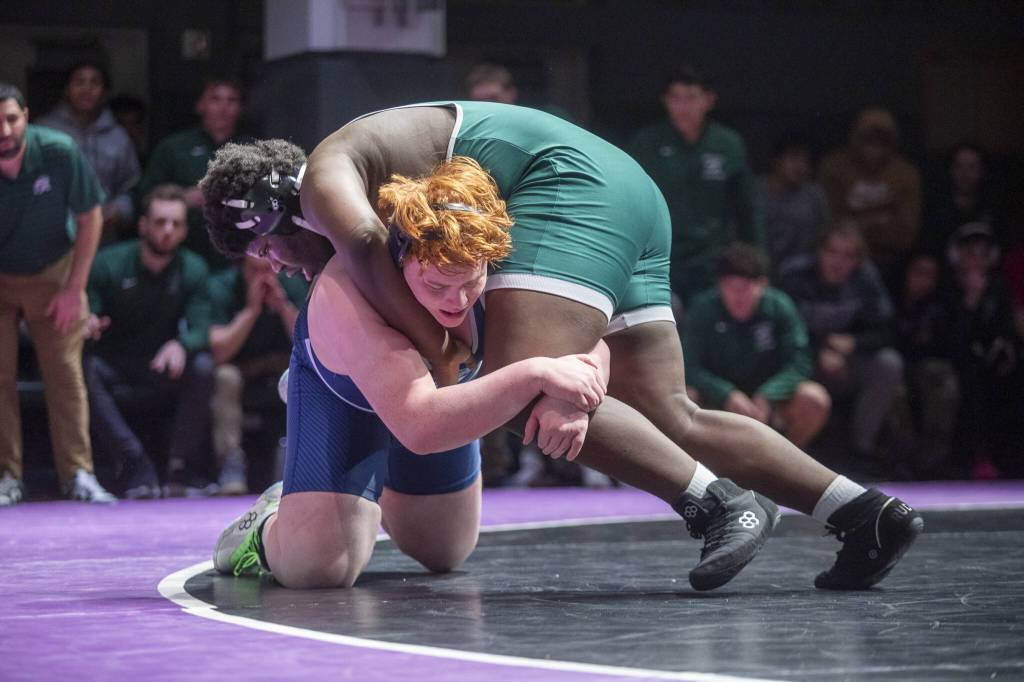 Edmonds-Woodways Edson Belizaire tries to flip Meadowdales Jaxson Hulbert on his back during the 285-pound match on Thursday, Jan. 16, 2025 in Edmonds, Washington. (Olivia Vanni / The Herald)