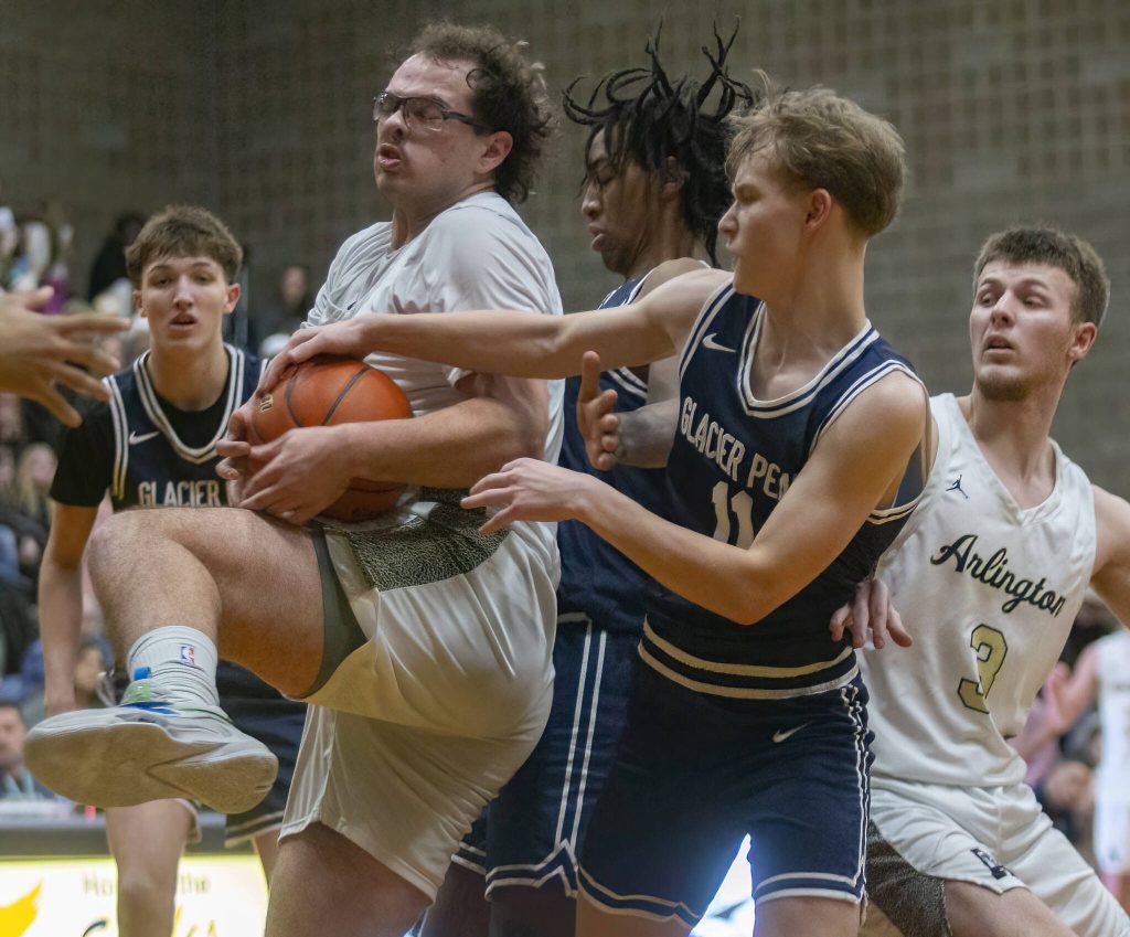 Multiple players scramble for a rebound during the game on Friday, Jan. 17, 2025 in Arlington, Washington. (Olivia Vanni / The Herald)