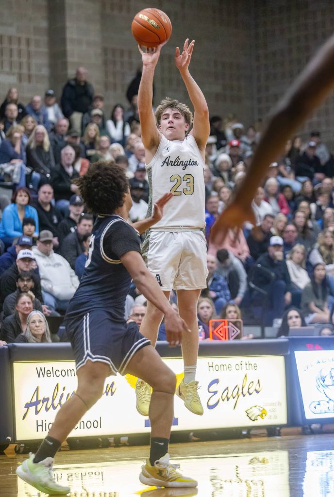 Arlingtons Leyton Martin makes a three point shot during the game against Glacier peakon Friday, Jan. 17, 2025 in Arlington, Washington. (Olivia Vanni / The Herald)