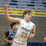 Arlingtons Leyton Martin puts three fingers in the air after making a three point shot during the game against Glacier Peak on Friday, Jan. 17, 2025 in Arlington, Washington. (Olivia Vanni / The Herald)