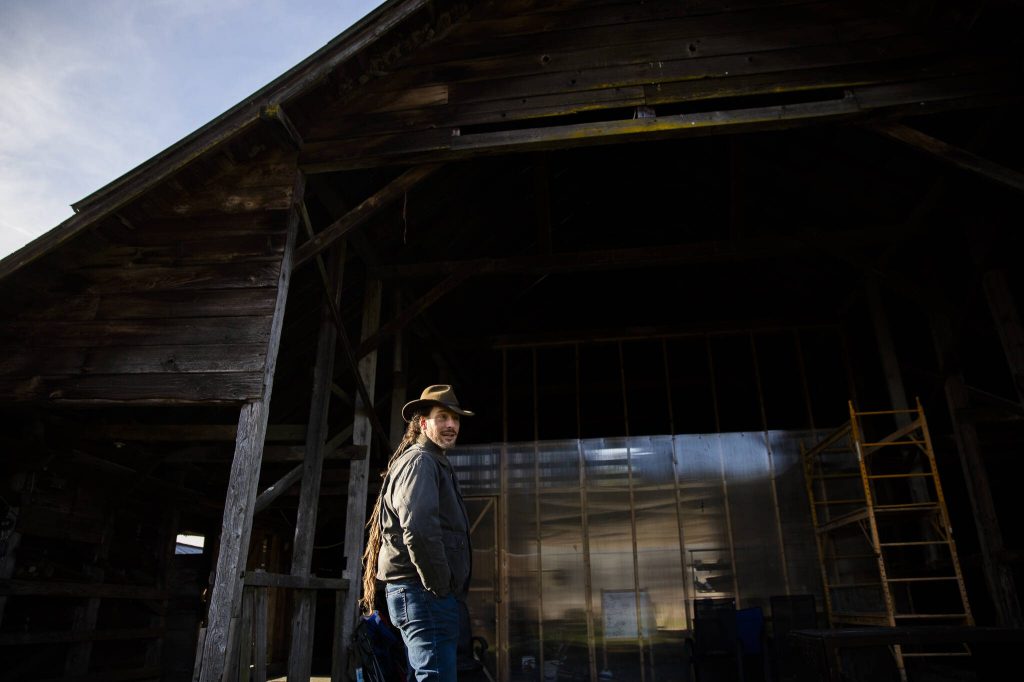 Dave Boehnlein outside of Rooted Northwests barn and gathering space on Thursday, Jan. 23, 2025 in Arlington, Washington. (Olivia Vanni / The Herald)