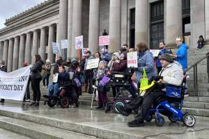 Advocates for people with intellectual and developmental disabilities rallied on the state capitol steps on Jan. 17. The group asked for rate increases for support staff and more funding for affordable housing. (Laurel Demkovich/Washington State Standard)