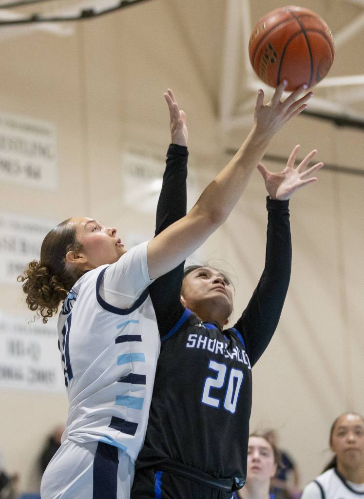 Meadowdales Mia Brockmeyer leaps in the air for a rebound during the game against Shorewood on Wednesday, Jan. 22, 2025 in Lynnwood, Washington. (Olivia Vanni / The Herald)