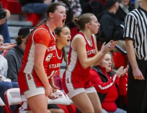 The Stanwood bench reacts to a three point shot during the game against Snohomish on Thursday, Jan. 9, 2025 in Snohomish, Washington. (Olivia Vanni / The Herald)