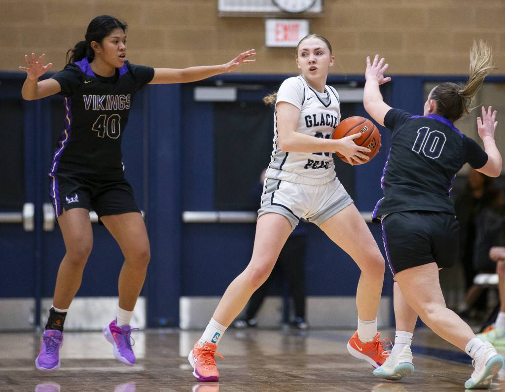 Glacier Peaks Rikki Miller tries to keep possession of the ball while looking for an open teammate to pas to during the game against Lake Stevens on Friday, Jan. 24, 2025 in Snohomish, Washington. (Olivia Vanni / The Herald)