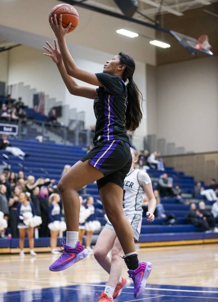Lake Stevens Noelani Tupua makes a layup during the game against Glacier Peak on Friday, Jan. 24, 2025 in Snohomish, Washington. (Olivia Vanni / The Herald)