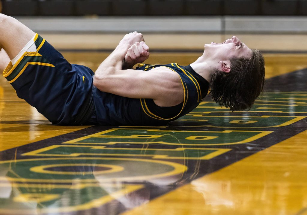 Shorecrests Porter Swanson yells from the ground after making a shot and getting fouled during the game against Edmonds-Woodway on Tuesday, Jan. 28, 2025 in Edmonds, Washington. (Olivia Vanni / The Herald)