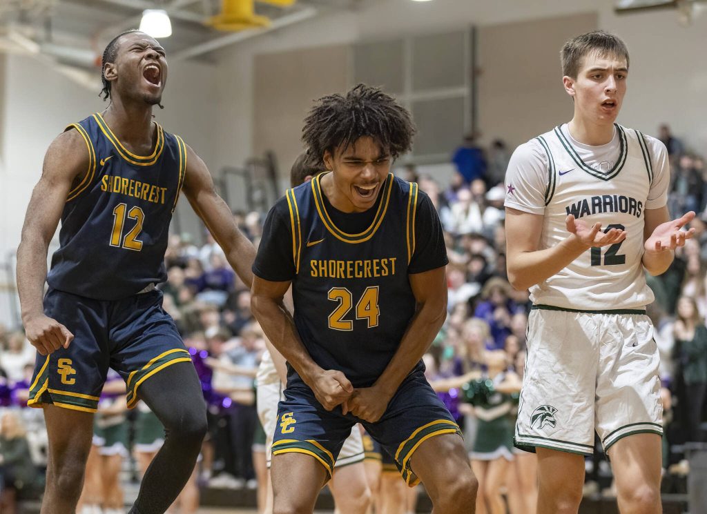 Shorecrests Junior Kagarabi and Devan Jones celebrate a foul called on Edmonds-Woodways William Alseth who raises his hands in confusion during the game on Tuesday, Jan. 28, 2025 in Edmonds, Washington. (Olivia Vanni / The Herald)