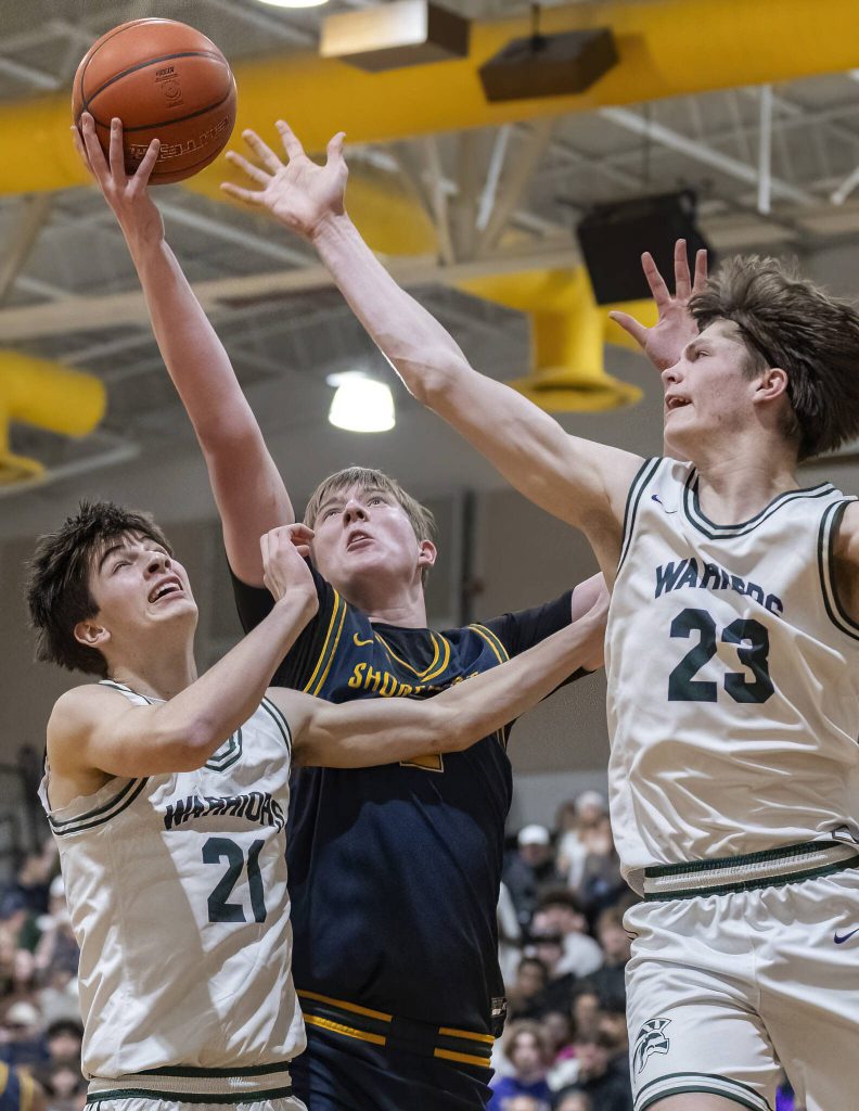 Shorecrests Jack Thompson makes a layup off a rebound during the game against Edmonds-Woodway on Tuesday, Jan. 28, 2025 in Edmonds, Washington. (Olivia Vanni / The Herald)