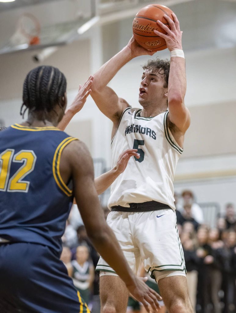 Edmonds-Woodways Cam Hiatt makes a jump shot during the game against Shorecrest on Tuesday, Jan. 28, 2025 in Edmonds, Washington. (Olivia Vanni / The Herald)
