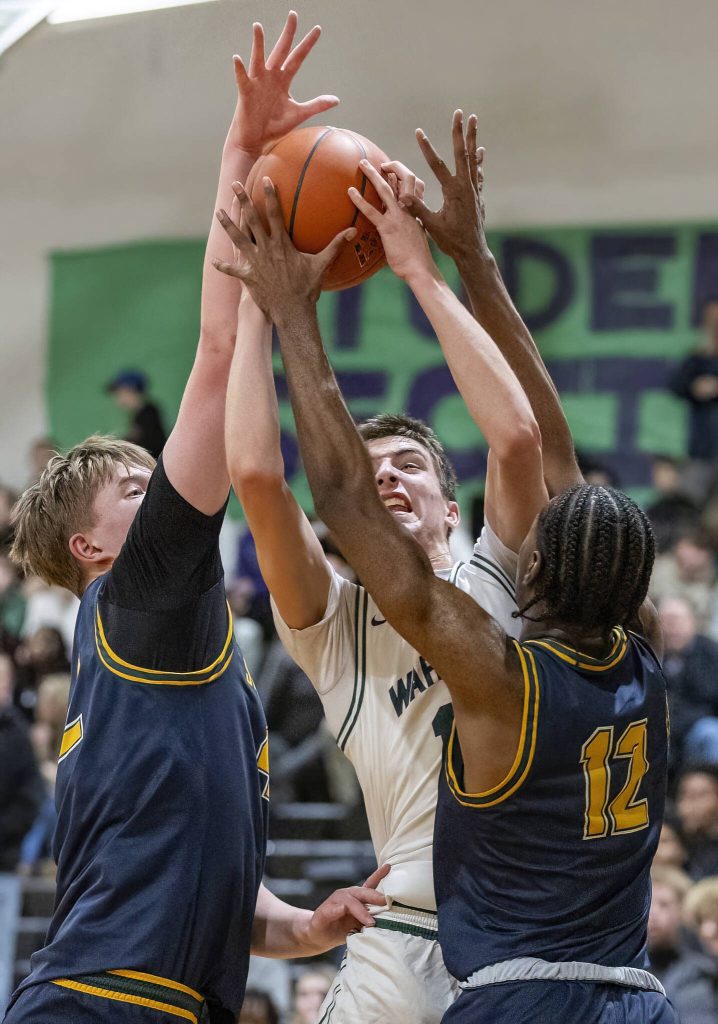 Edmonds-Woodways William Alseth is fouled while trying to take a shot during the game against Shorecrest on Tuesday, Jan. 28, 2025 in Edmonds, Washington. (Olivia Vanni / The Herald)