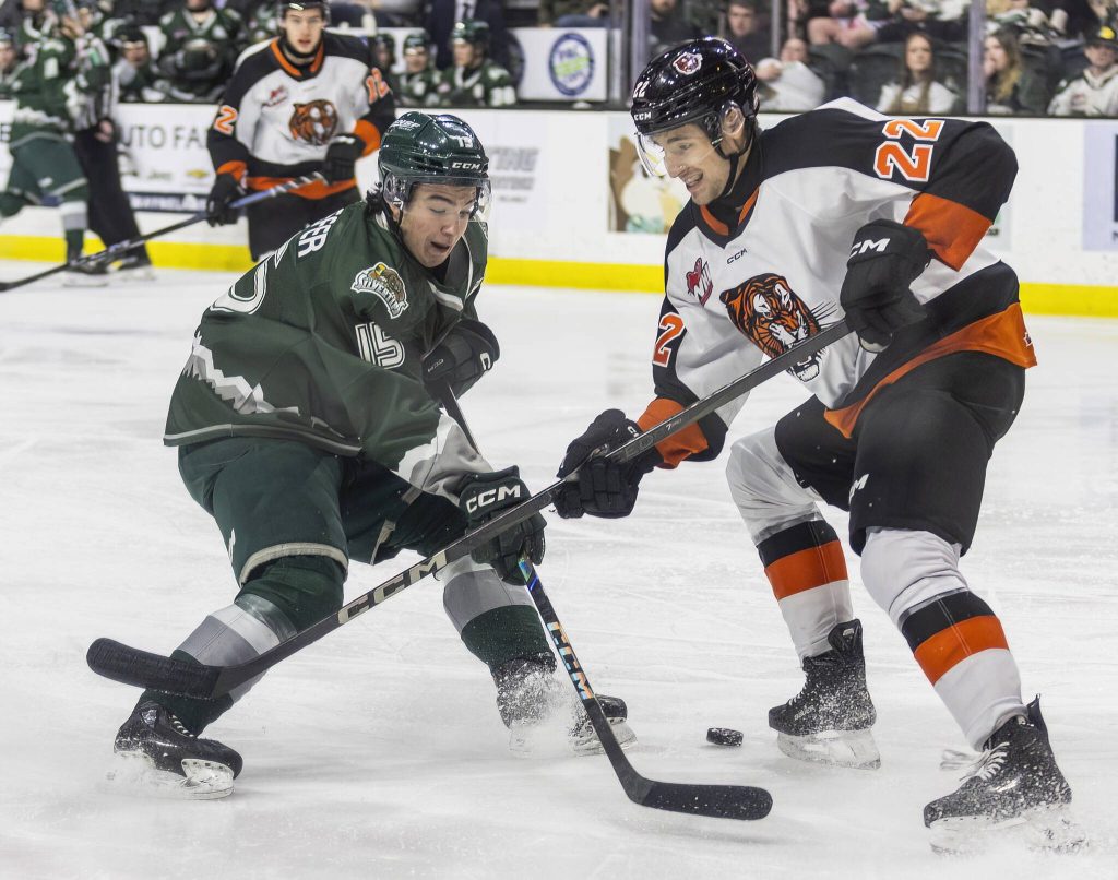 Slivertips Clarke Schaefer tries to maneuver around Medicine Hats Josh Van Mulligen during the game on Wednesday, Jan. 29, 2025 in Everett, Washington. (Olivia Vanni / The Herald)