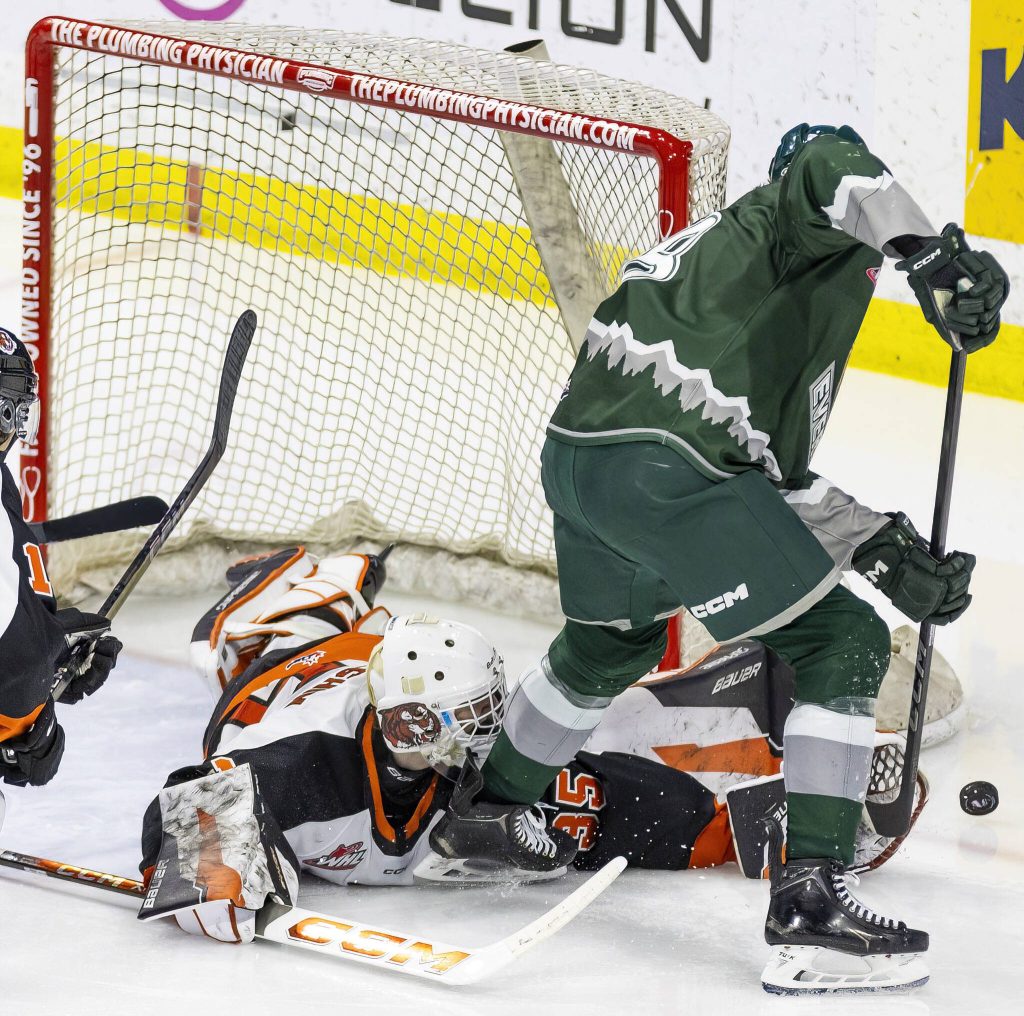 Slivertips Shea Busch has his shot blocked by Medicine Hats Harrison Meneghin during the game on Wednesday, Jan. 29, 2025 in Everett, Washington. (Olivia Vanni / The Herald)
