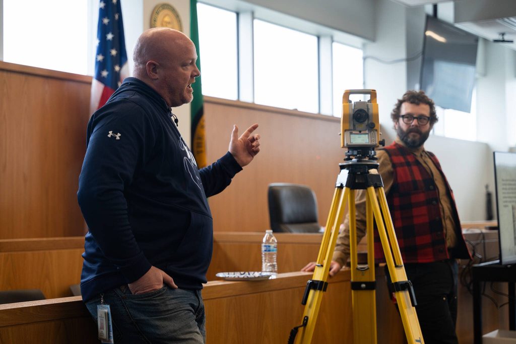 PHOTOS BY Will Geschke / The Herald
Public works employees Shawn Roland, left, and Lucas Rate speak to students on Thursday during Civic Education Day at the Snohomish County Campus in Everett.