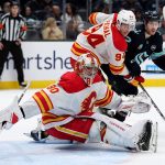 Dan Vladar (80) of the Calgary Flames looks to make a save against the Seattle Kraken during the second period at Climate Pledge Arena on Feb. 2, 2025, in Seattle. (Steph Chambers / Getty Images / Tribune News Services)