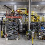 Construction contractors add exhaust pipes for Centurys liquid metal walls at Zap Energy on Monday, Feb. 3, 2025 in Everett, Washington. (Olivia Vanni / The Herald)