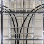 Electrical wires runs overhead from the power supply to Centurys plasma chamber at Zap Energy on Monday, Feb. 3, 2025 in Everett, Washington. (Olivia Vanni / The Herald)