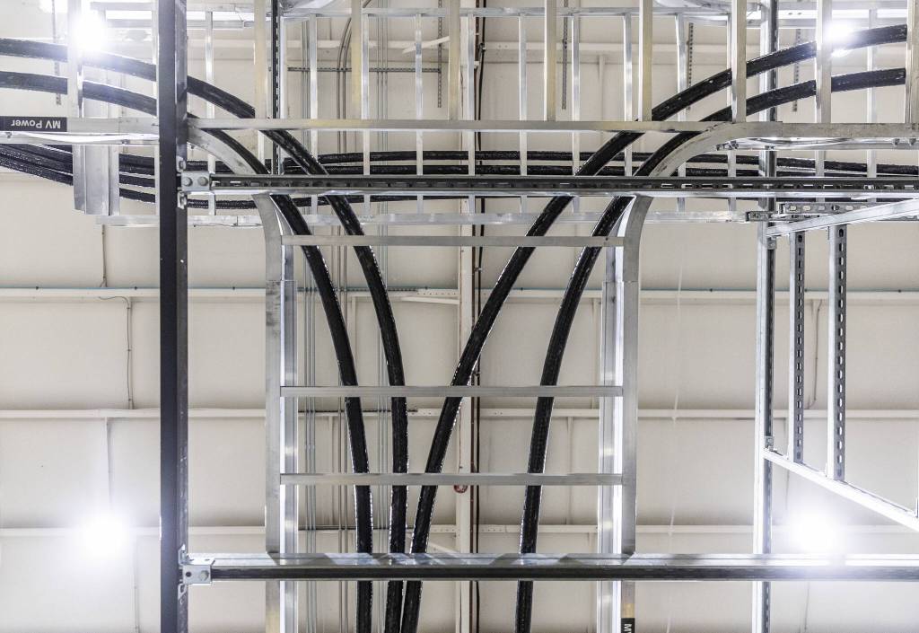 Electrical wires runs overhead from the power supply to Centurys plasma chamber at Zap Energy on Monday, Feb. 3, 2025 in Everett, Washington. (Olivia Vanni / The Herald)