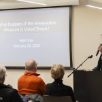 Edmonds resident Matt Cox makes a presentation on his research to those gathered for an Edmonds Civic Roundtable event discussing the RFA annexation vote on Monday, Feb. 10, 2025 in Edmonds, Washington. (Olivia Vanni / The Herald)