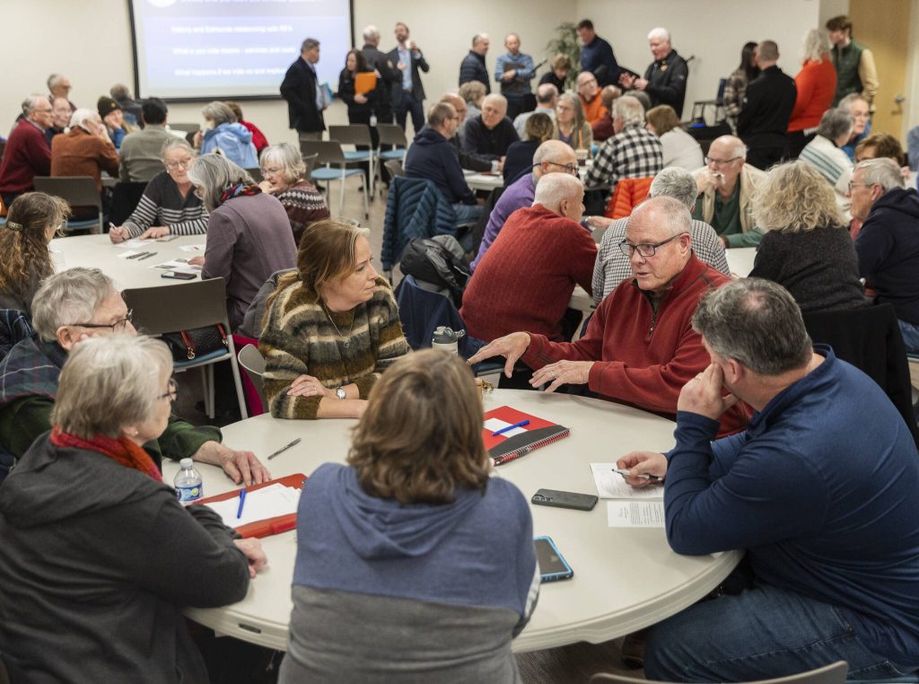 People talks to those at their table during an Edmonds Civic Roundtable event about the RFA annexation vote on Monday, Feb. 10, 2025 in Edmonds, Washington. (Olivia Vanni / The Herald)