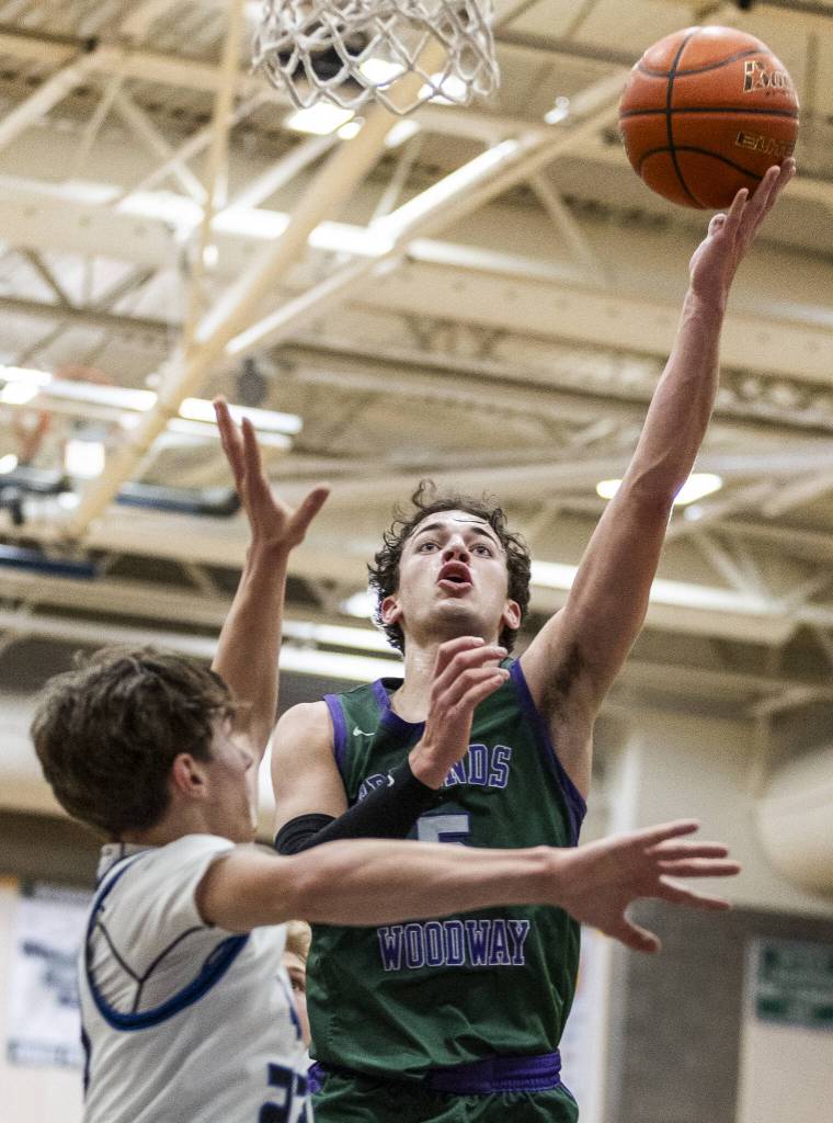 Edmonds-Woodways Cam Hiatt makes a layup during the game against Shorewood on Tuesday, Feb. 4, 2025 in Shoreline, Washington. (Olivia Vanni / The Herald)