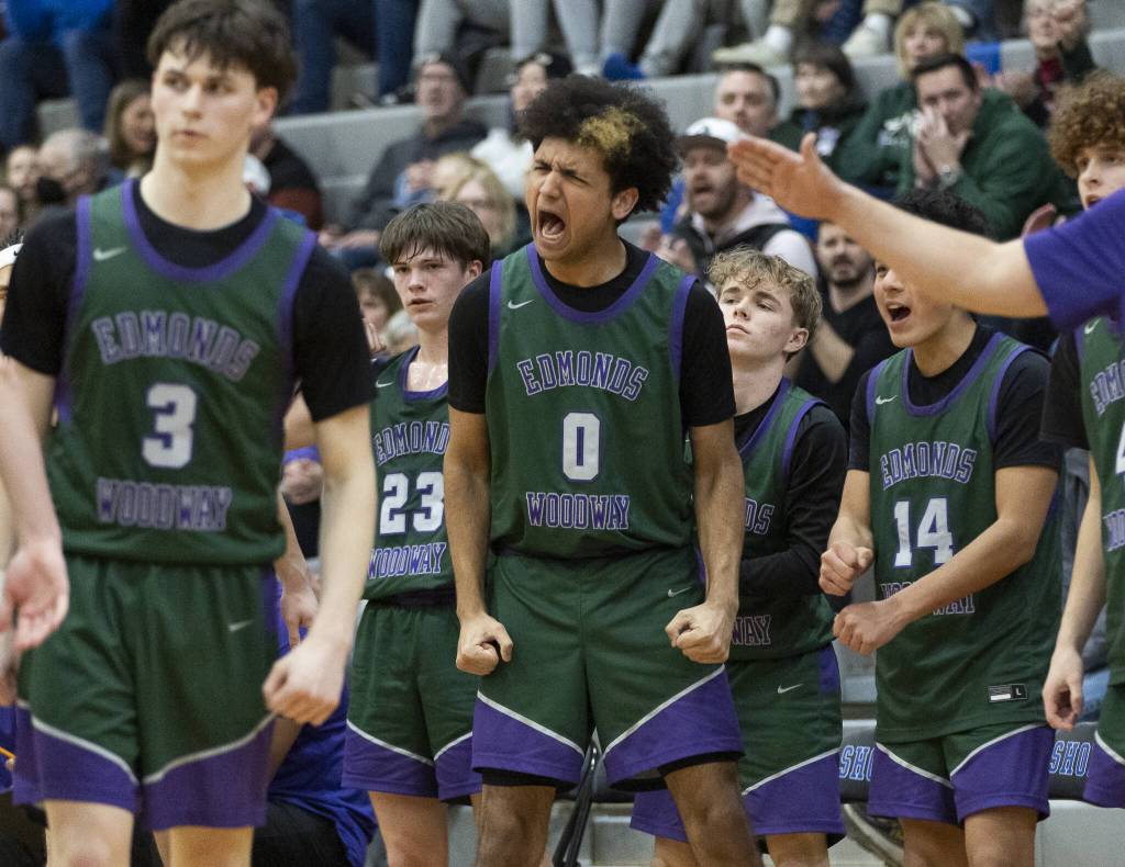 The Edmonds-Woodway bench reacts to a foul call during the game against Shorewood on Tuesday, Feb. 4, 2025 in Shoreline, Washington. (Olivia Vanni / The Herald)
