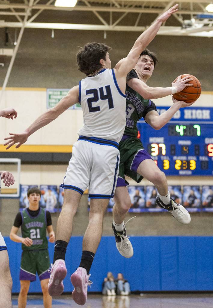 Edmonds-Woodways Grant Williams tries to make a layup while being guarded by Shorewoods Jaden Marlow during the game on Tuesday, Feb. 4, 2025 in Shoreline, Washington. (Olivia Vanni / The Herald)