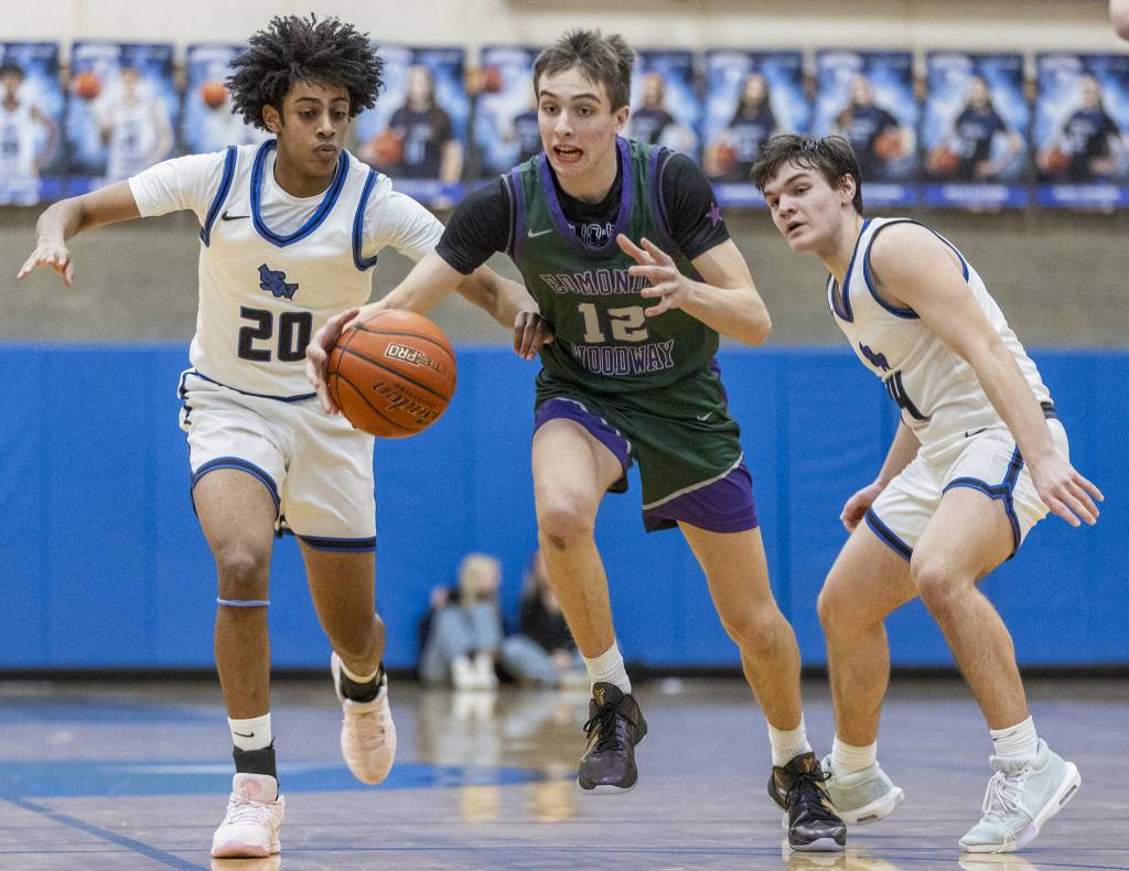 Edmonds-Woodways William Alseth dribbles the ball down the court during the game against Shorewood on Tuesday, Feb. 4, 2025 in Shoreline, Washington. (Olivia Vanni / The Herald)