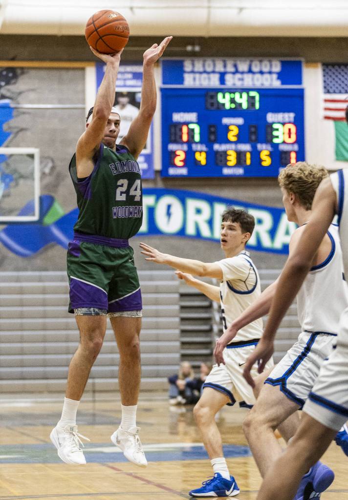 Edmonds-Woodways Julian Gray makes a three point shot during the game against Shorewood on Tuesday, Feb. 4, 2025 in Shoreline, Washington. (Olivia Vanni / The Herald)