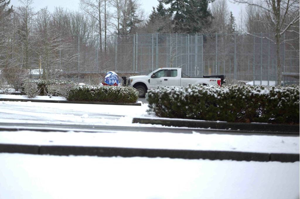 A Snohomish School District truck clears the parking lot at Glacier Peak High School on Wednesday, Feb. 5, 2025. (Aaron Coe / The Herald)