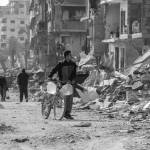 Saher Alghorra / The New York Times
A young man carries water past the destroyed buildings of a neighborhood in the Gaza Strip, Feb. 2. President Trumps proposal to own the Gaza Strip and transfer its population elsewhere has stirred condemnation and sarcasm, but it addresses a real and serious challenge: the future of Gaza as a secure, peaceful, even prosperous place.
