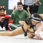 People watch and cheer on Jacksons Emily Ortiz Marquez in the 145-pound match during the 4A girls wrestling district tournament on Friday, Feb. 7, 2025 in Mill Creek, Washington. (Olivia Vanni / The Herald)