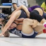 Lake Stevens Dallas Kautz rolls Glacier Peaks Samantha Wilner onto her back during the 170-pound match at the 4A girls wrestling district tournament on Friday, Feb. 7, 2025 in Mill Creek, Washington. (Olivia Vanni / The Herald)
