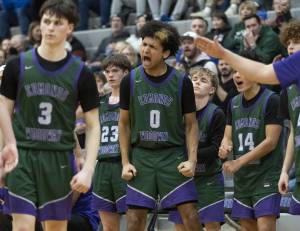 The Edmonds-Woodway bench reacts to a foul call during the game against Shorewood on Tuesday, Feb. 4, 2025 in Shoreline, Washington. (Olivia Vanni / The Herald)