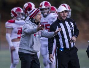 Stanwood High School football coach Jeff Scoma talks with the referees during the 3A quarterfinal game against Odea on Saturday, Nov. 19, 2022 in Seattle, Washington. (Olivia Vanni / The Herald)