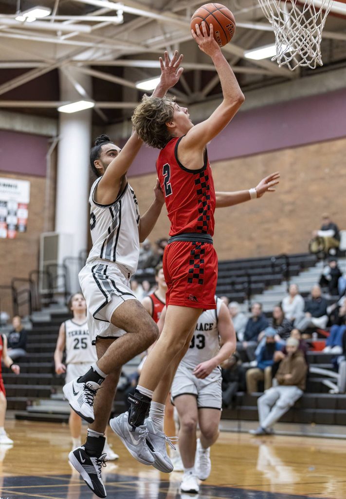 Snohomishs Bryson Wheat makes a layup during the 3A district loser-out playoff game against Mountlake Terrace on Thursday, Feb. 13, 2025 in Mountlake Terrace, Washington. (Olivia Vanni / The Herald)