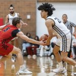 Snohomishs Chase Clark reaches out to knock the ball away from Mountlake Terraces Anthony Fuentes during the 3A district loser-out playoff game on Thursday, Feb. 13, 2025 in Mountlake Terrace, Washington. (Olivia Vanni / The Herald)