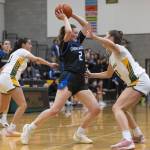 Shorewoods Lilly Marter tries to the pass the ball over the top of Shorecrests Cassie Chesnut during the 3A district playoff game on Friday, Feb. 14, 2025 in Shoreline, Washington. (Olivia Vanni / The Herald)